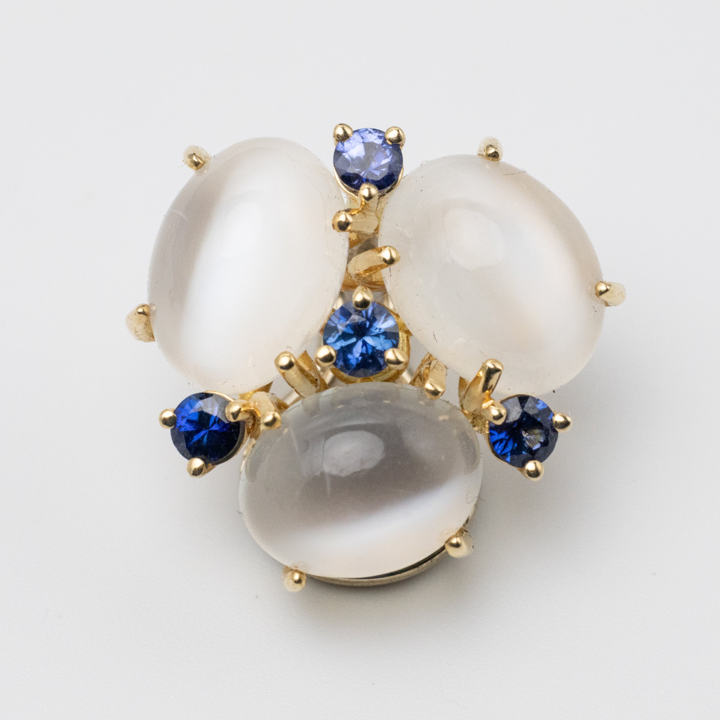 Sapphire and Moonstone clip ons close up view